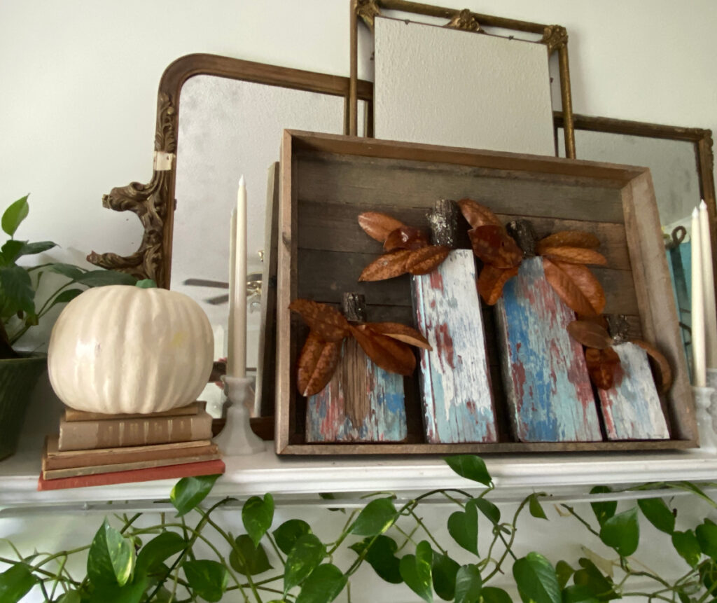 shopatblu the blue building antiques vintage wood pumpkins antique books mantle display
